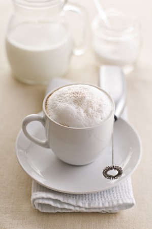 Fresh cappuccino with milk and sugar close up shootの写真素材
