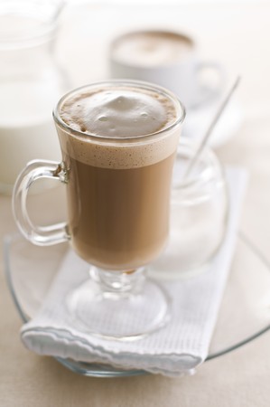 Large macchiato with cream and sugar close up の写真素材