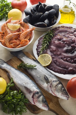 Fresh raw seafood with herbs close up shootの写真素材