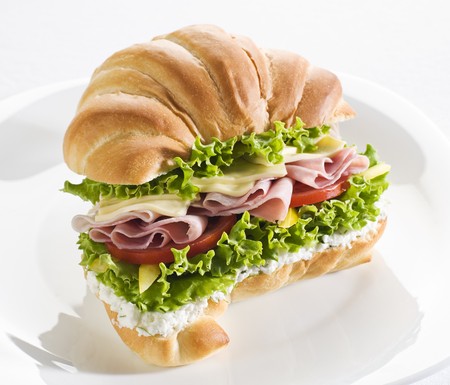 Fresh sandwich with ham, cheese and tomato close upの写真素材