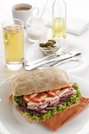 Fresh salami, cheese and tomato sandwich close up の写真素材