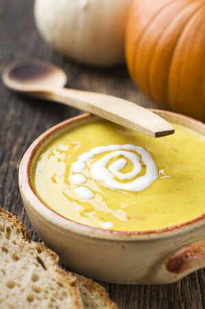 Fresh orange pumpkin soup close up shoot の写真素材