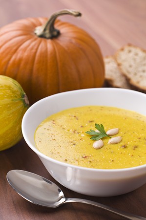 Fresh pumpkin soup with parsley close upの写真素材
