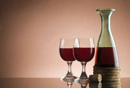 Bottle with red wine and glass close up の写真素材