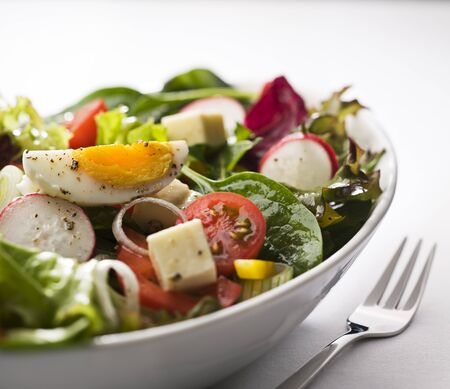 Fresh mixed salad with egg close up 
の写真素材