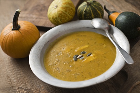 Fresh pumpkin soup on wooden table close upの写真素材