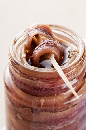 Fresh anchovie on toothpick close up shootの写真素材