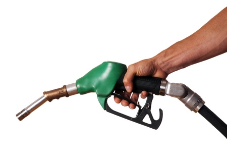 Male hand holding green pump isolated on whiteの写真素材