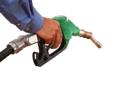 Male hand holding green pump isolated on whiteの写真素材
