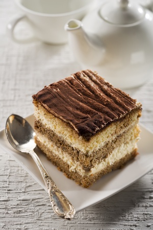 Tiramisu cake on white plate close up shootの写真素材