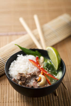 Chinese soup with rice, beef and vegetables close upの写真素材