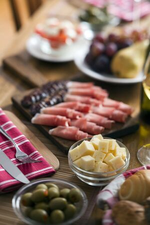 Fine cheese in focus on the dinner table close upの写真素材