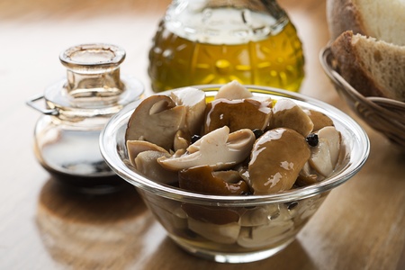 Canned boletus mushrooms in a bowl close up shootの写真素材