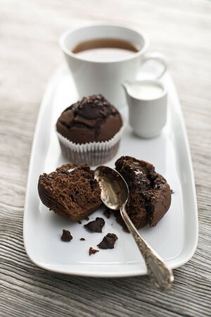Fresh chocolate muffins and tea close up shootの写真素材