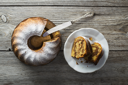 Slices of marble cake sprinkled with sugarの写真素材