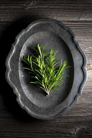 Fresh rosemary on wooden background close up shootの写真素材