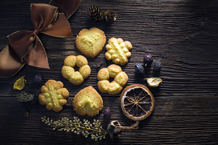 Fresh homemade cookies decorated on wooden backgroundの写真素材