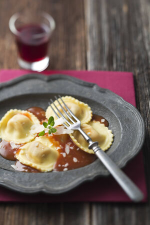 Ravioli pasta with red tomato sauceの写真素材