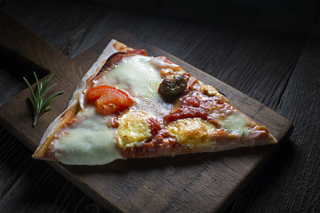 Slice of home made pizza close up shootの写真素材