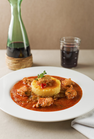 Portion of traditional meat stew - goulash on white plateの写真素材
