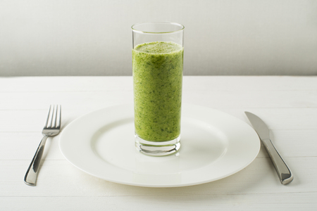 Glass of Healthy green smoothie with vegetablesの写真素材