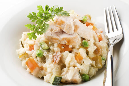 Risotto with vegetable and chicken close upの写真素材