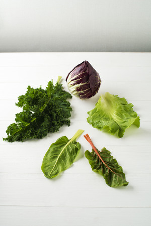 Fresh collection salad on a white tableの写真素材