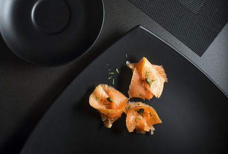 Pieces of fresh smoked salmon served on a plateの写真素材