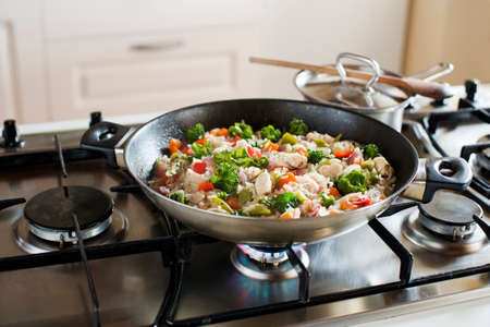 Cooking risotto on the stove close-upの写真素材