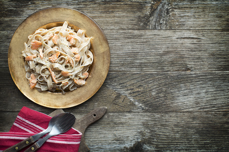 Fresh pasta with smoked salmon in the sauceの写真素材