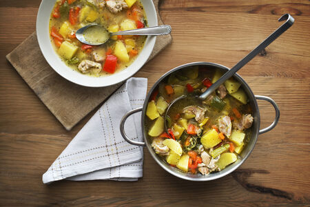 Served warm stew with vegetables and meat on the plateの写真素材