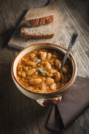 White bean stew with bread close upの写真素材