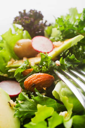 Fresh mixed green salad with avocado close upの写真素材