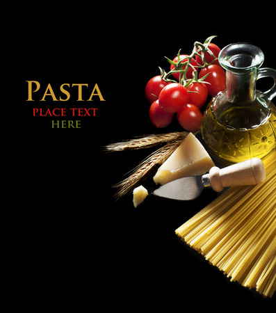 Spaghetti and tomatoes with parmesan cheese on black backgroundの写真素材