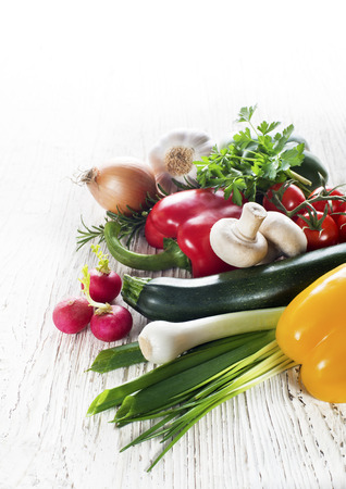 Fresh mixed vegetables collection on white wooden backgroundの写真素材
