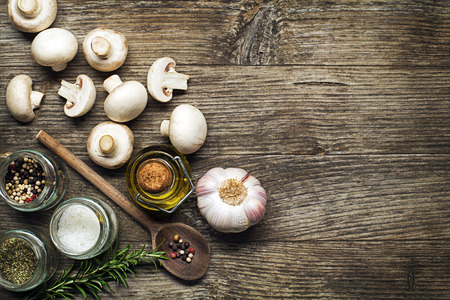 Ingredients with fresh mushrooms on wooden backgroundの写真素材