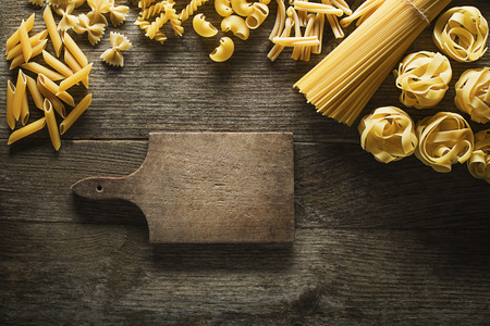 Pasta collection on rustic wooden backgroundの写真素材