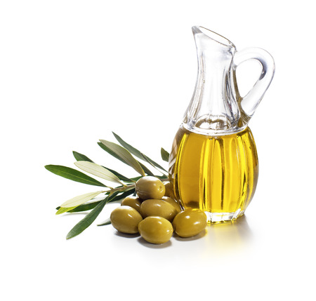 Olive oil and olive branch on white backgroundの写真素材