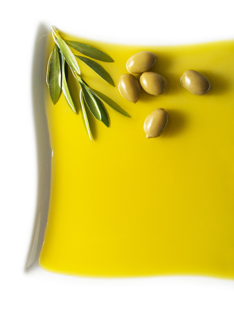 Olive fruit in oil background close upの写真素材