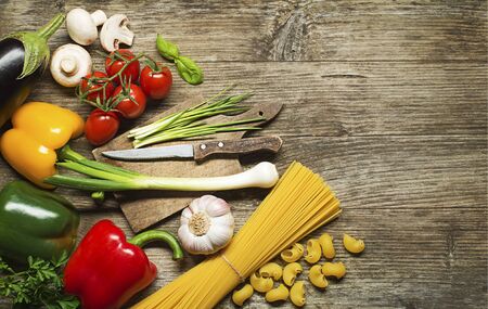 Pasta with Vegetables ingredients on old wooden tableの写真素材