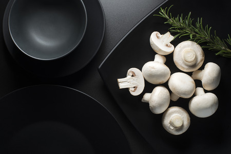Mushrooms champignon a black background close upの写真素材
