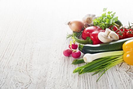 Vegetables on white wooden background close upの写真素材