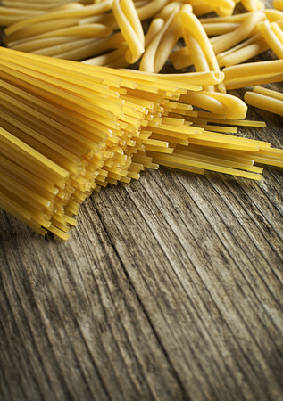 Pasta collection on rustic wooden background close upの写真素材