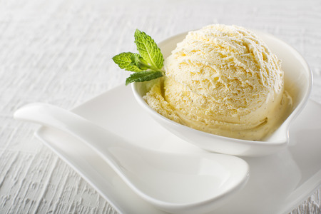 Ice cream in bowl on white backgroundの写真素材