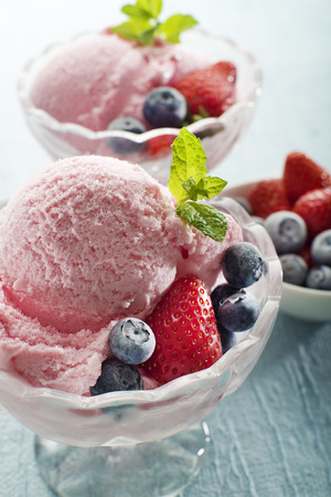 Fruit ice cream with blueberries and strawberriesの写真素材