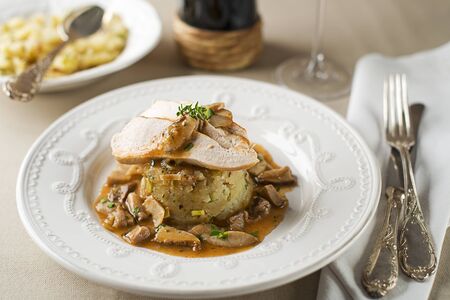 Chicken breast in mushroom sauce with potatoes close upの写真素材