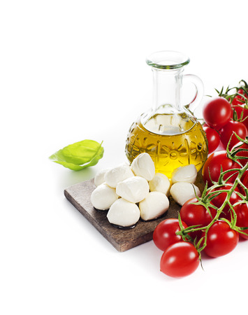 Mozzarella Cheese with Tomatoes and olive oil isolated on whiteの写真素材