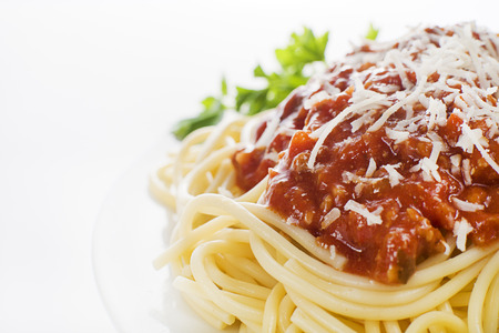 Plate of fresh spaghetti with tomato sauce and parmesan cheese.の写真素材