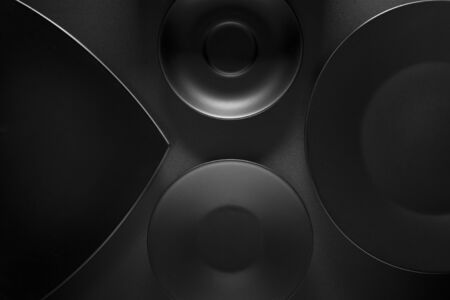 Top view of black empty plates on dark grey background.の写真素材