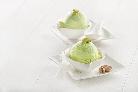 Fresh pistachio ice cream in cup close up.の写真素材
